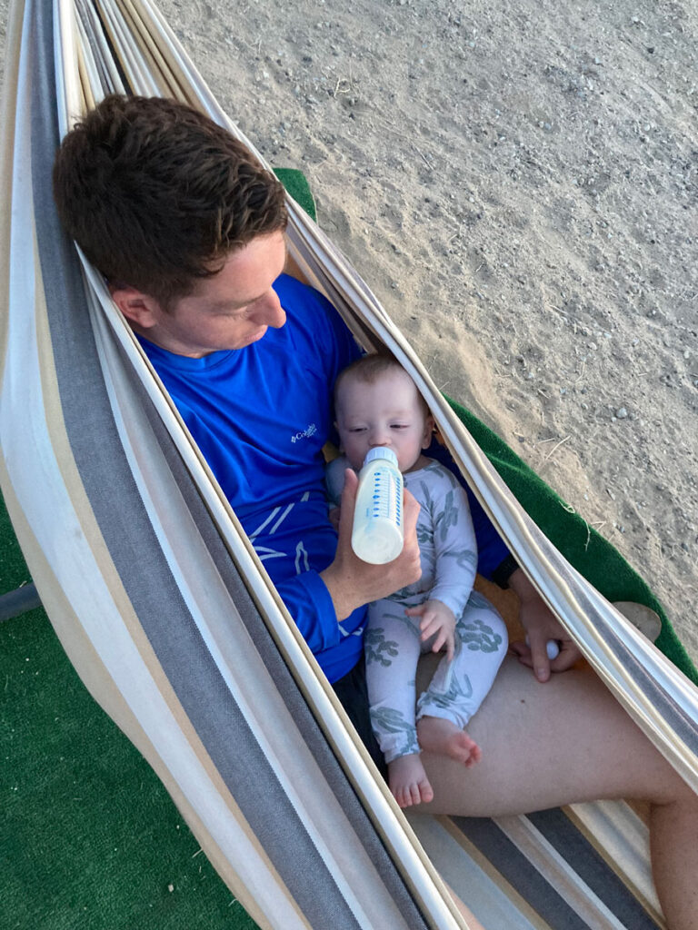 father holding baby in hammock - Road trip to Joshua Tree National Park with baby