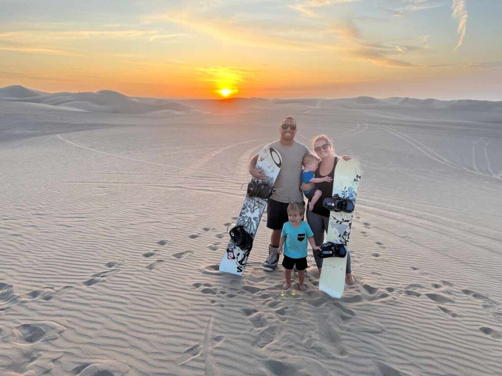 family Sand Boarding Huacachina in Peru with toddlers