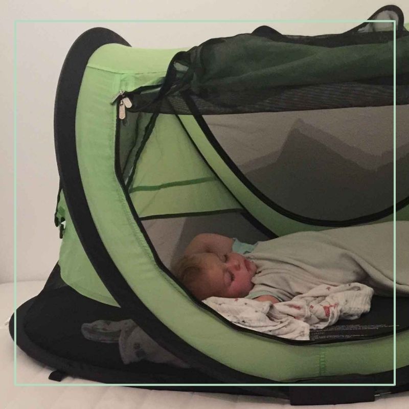 toddler sleeping in kidco peapod plus travel tent