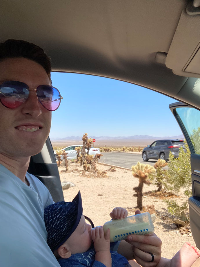 father feeding baby in car - Visiting Joshua Tree with a Baby