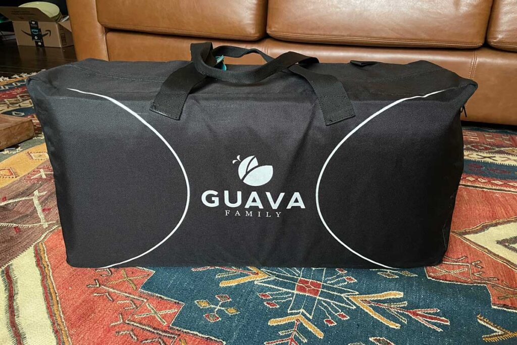 guava family lotus travel crib all packed in backpack carry case