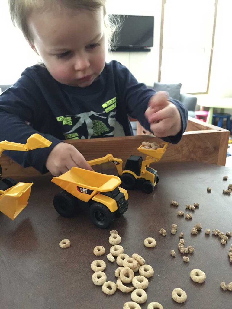 Construction trucks make the best 2 year old travel toys.