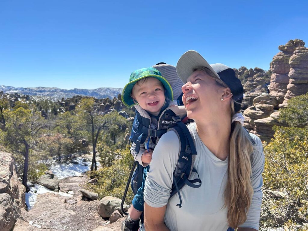 Mother carrying baby in Deuter Kid Comfort Active Hiking Carrier.