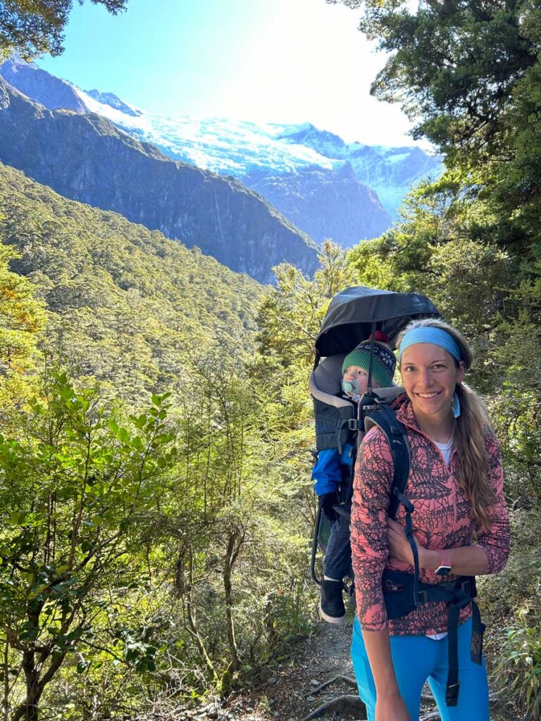 Mother carrying baby in Deuter Hiking carrier for babies & toddlers.