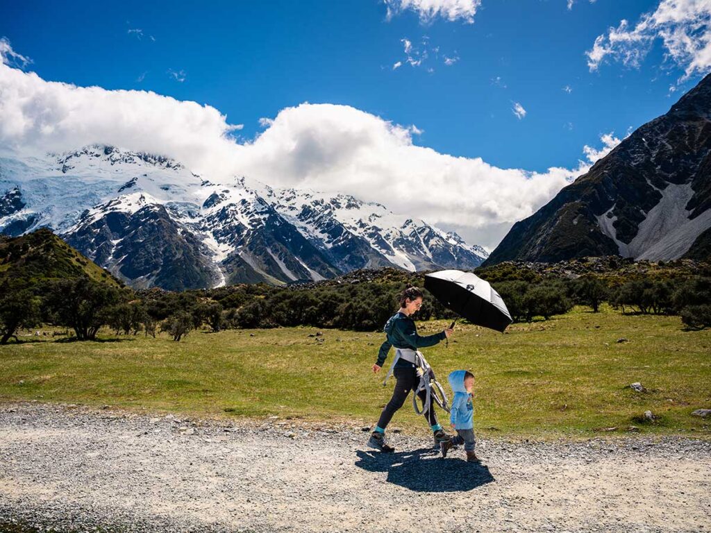 mother & toddler hiking Hooker Valley Track - New Zealand