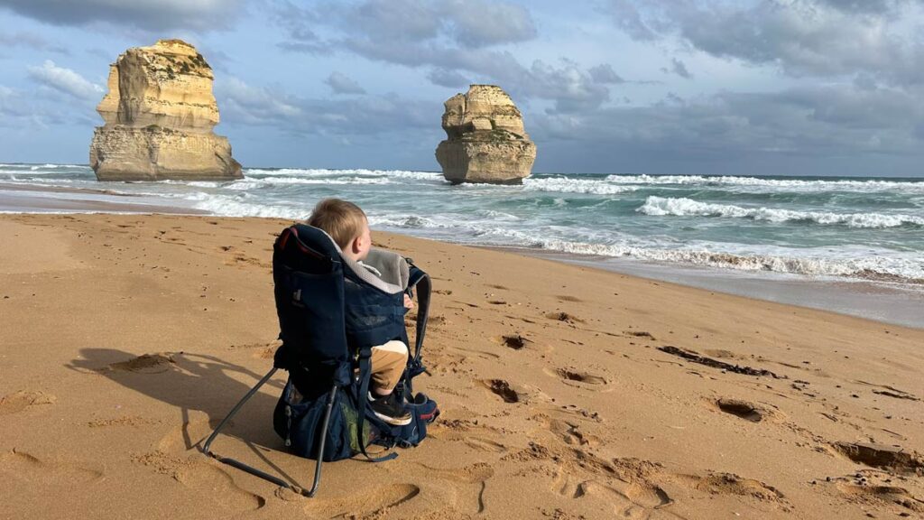 toddler in Deuter Kid Comfort Active Hiking Carrier on the beach.