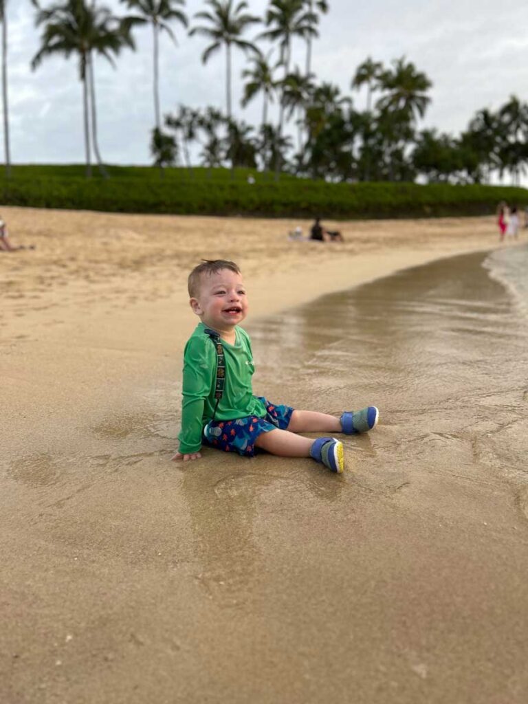 toddler playing on beach in Hawaii