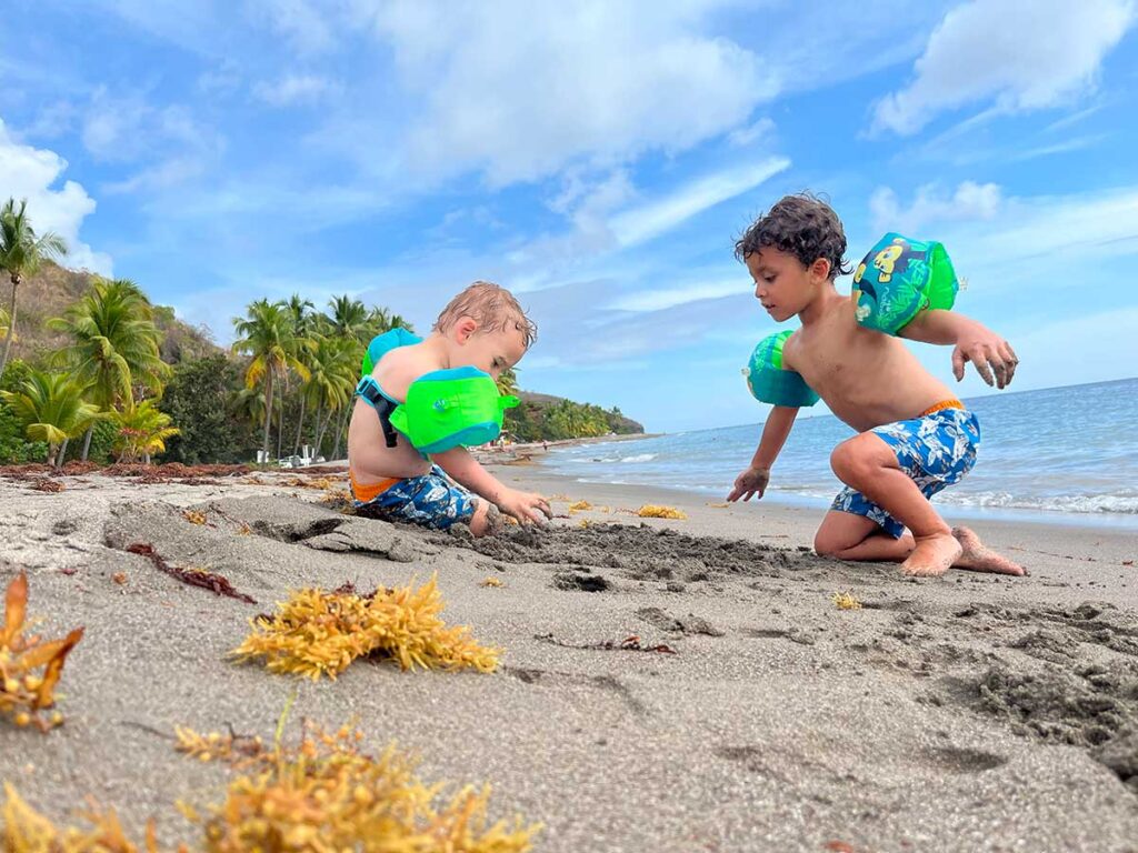 toddler playing on the beach in Martinique