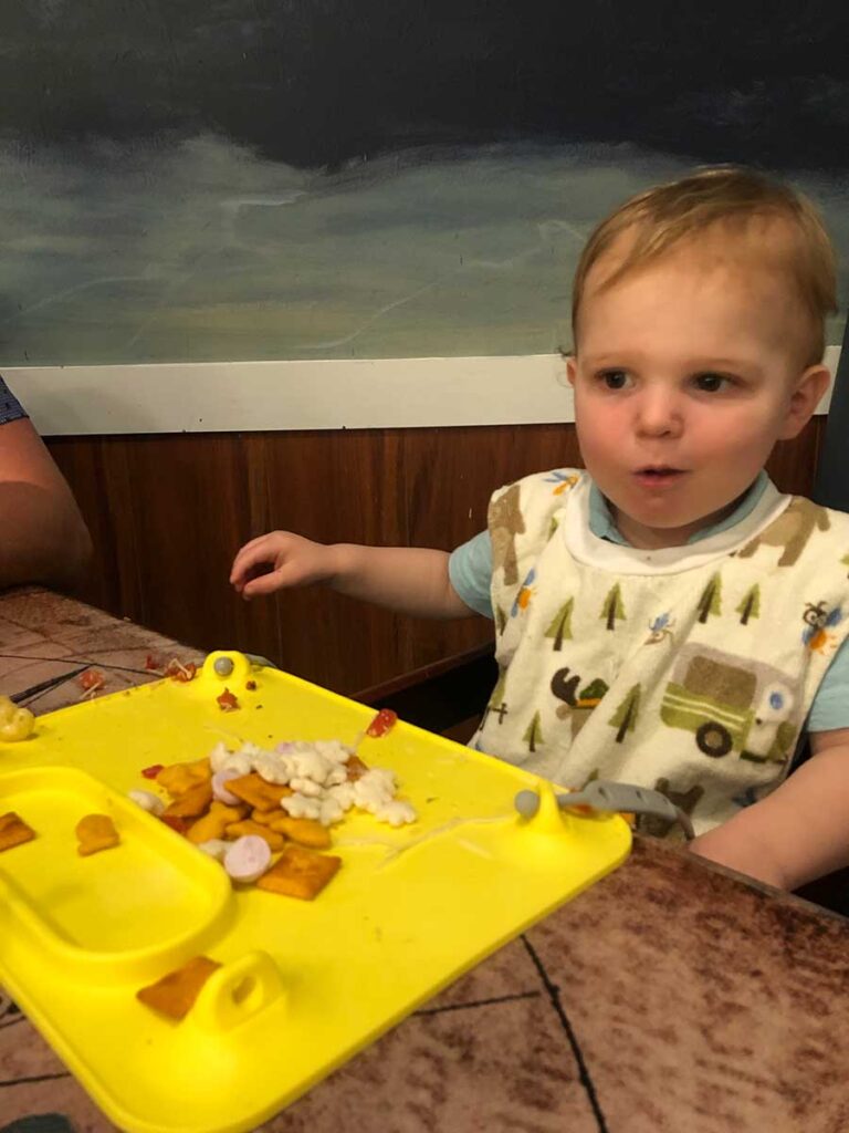 toddler using Busy Baby Mat