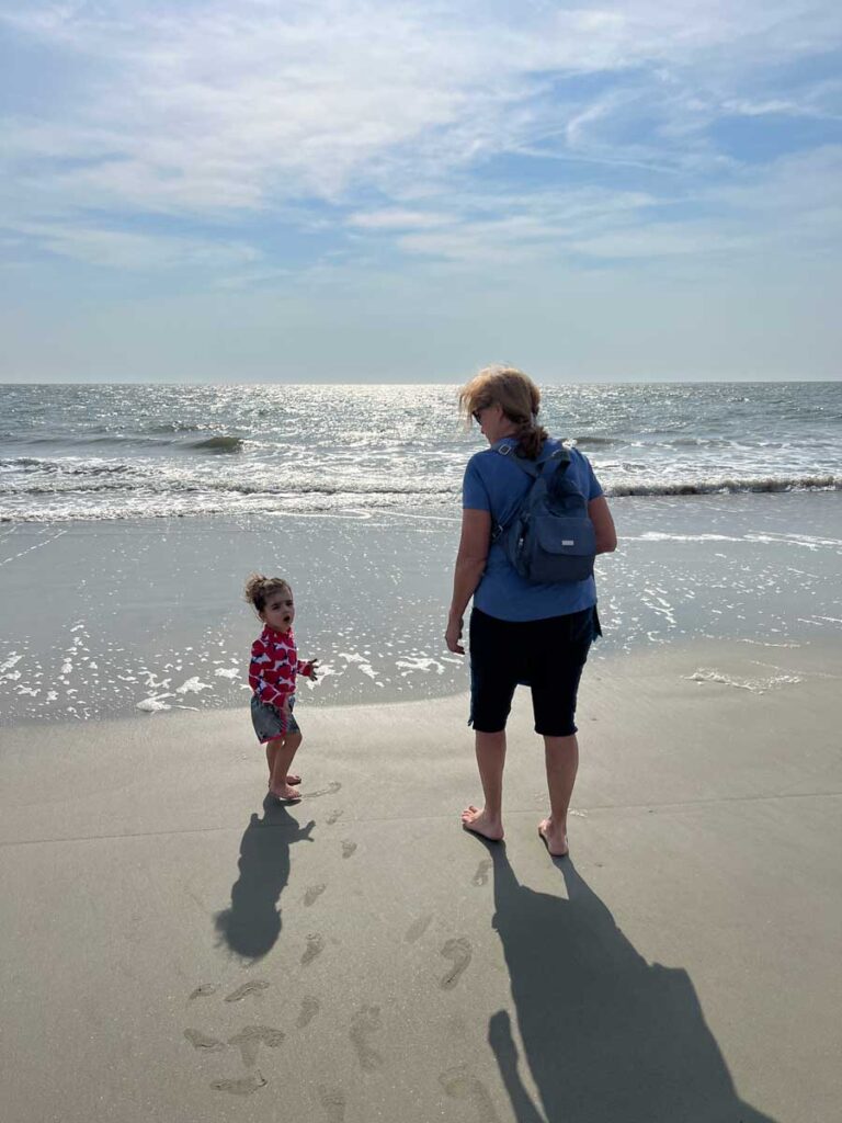 walking on beach in Hilton Head with toddler