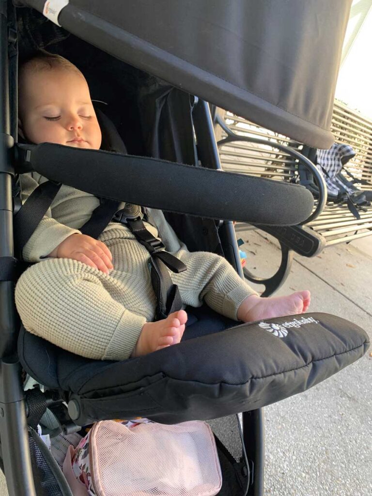 Baby sleeping in an ErgoBaby stroller. 