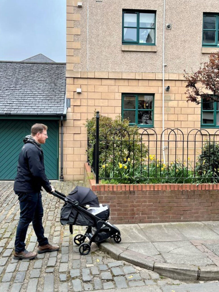 ErgoBaby Metro+ Stroller for travel being used on cobblestone.