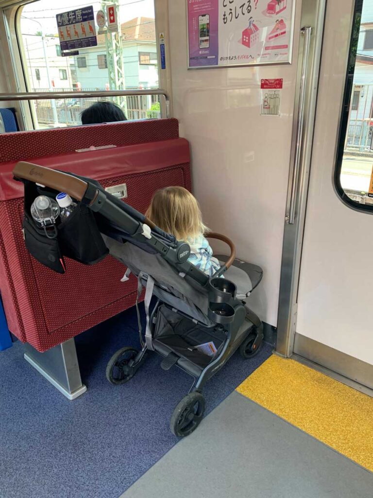 Using Metro Deluxe stroller on a train in Japan.