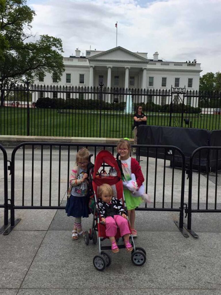 family standing in front of the White House.