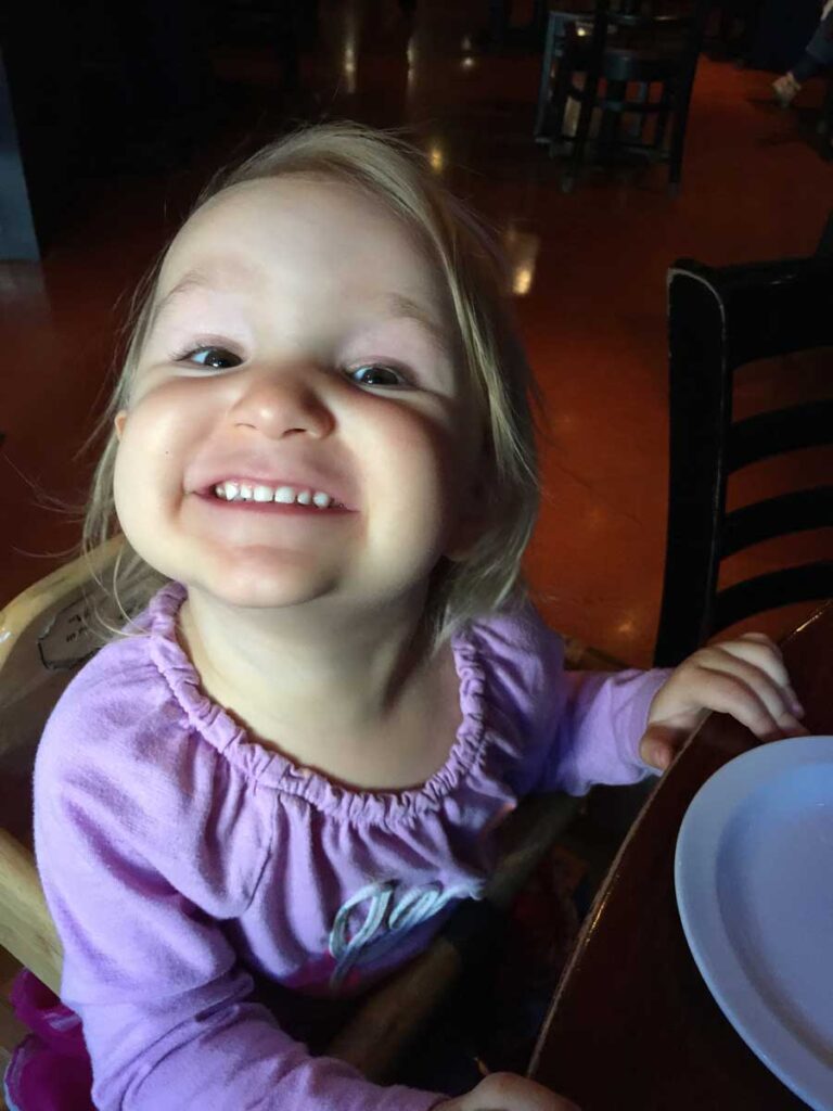 young girl smiling.