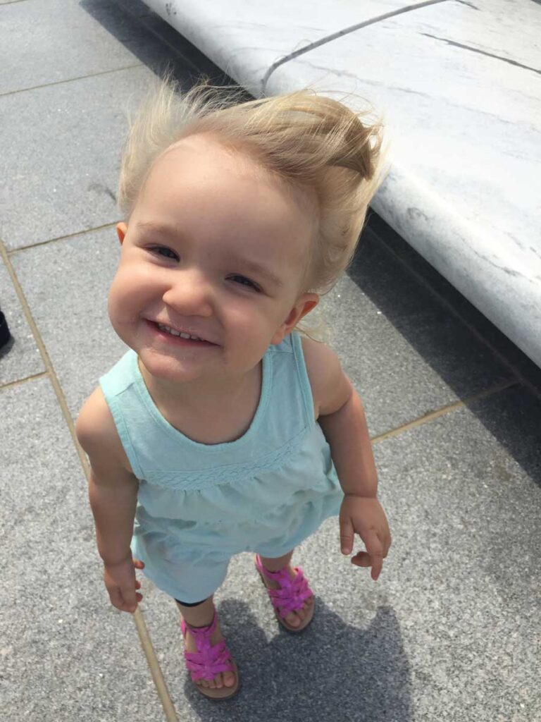 young girl smiling at the camera.