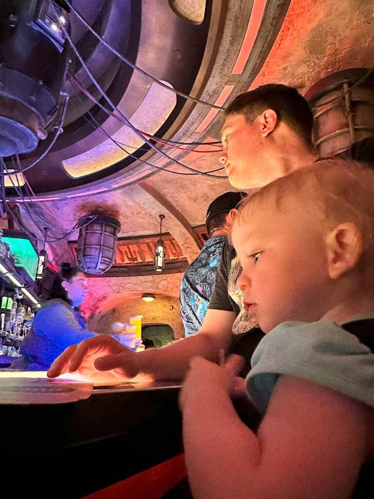 baby and dad at a restaurant in Disney.