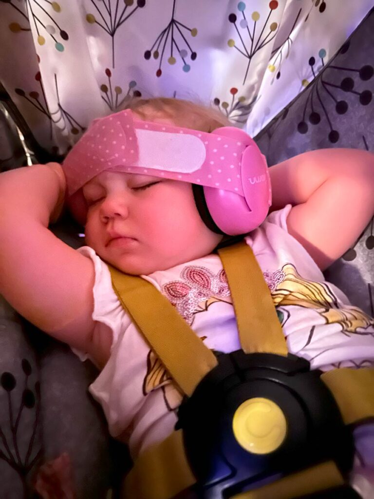 Baby sleeping with headphones on.