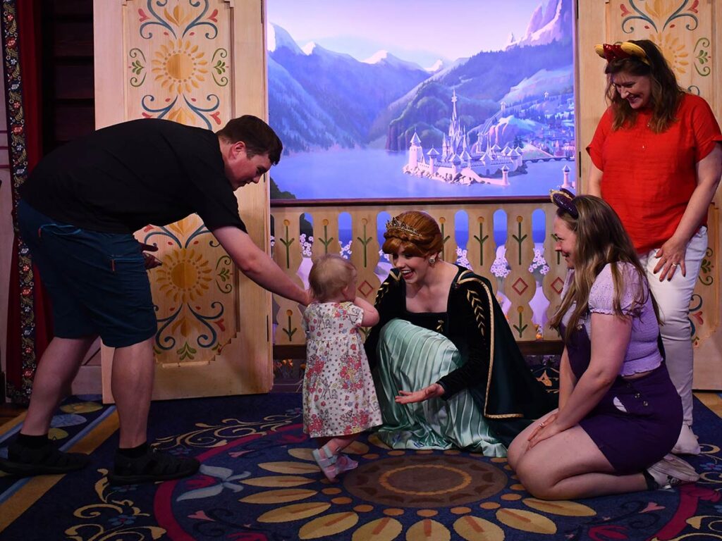 Family with Disney character.