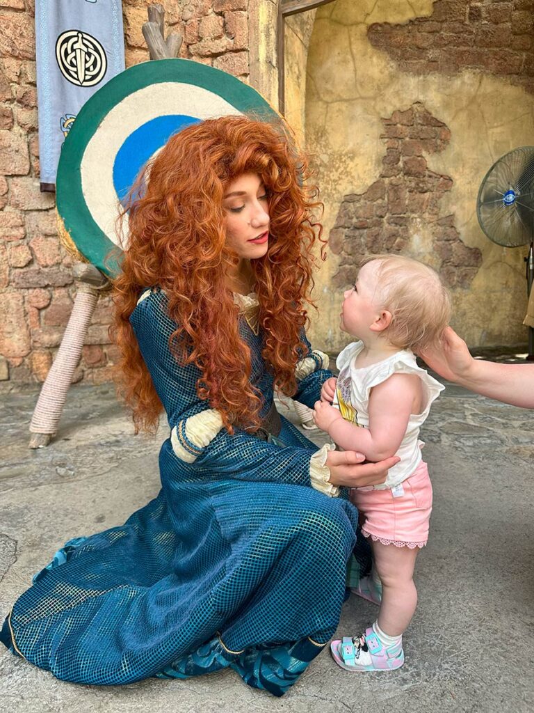 Baby with Disney character.