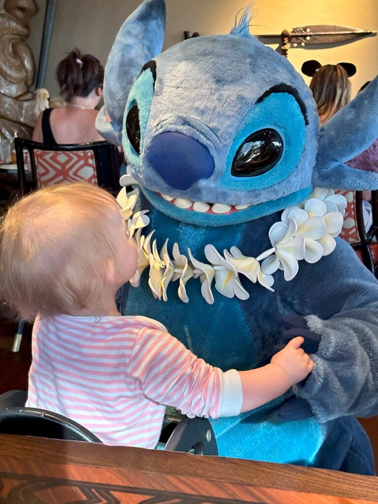 Baby with Stitch at Disneyworld.