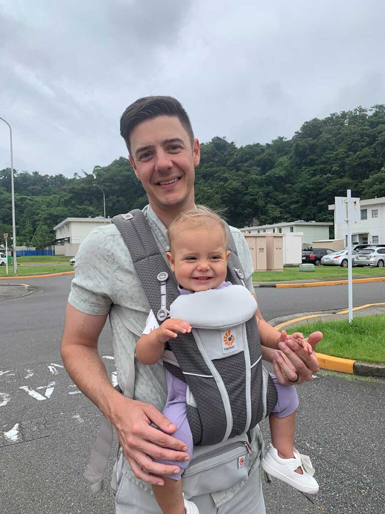 Father carrying baby in Ergobaby Omni Breeze Baby Carrier.