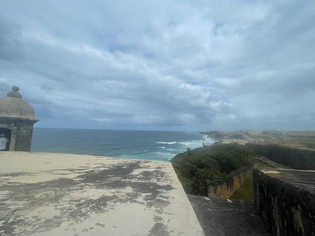 View of the ocean, with a cloudy sky.